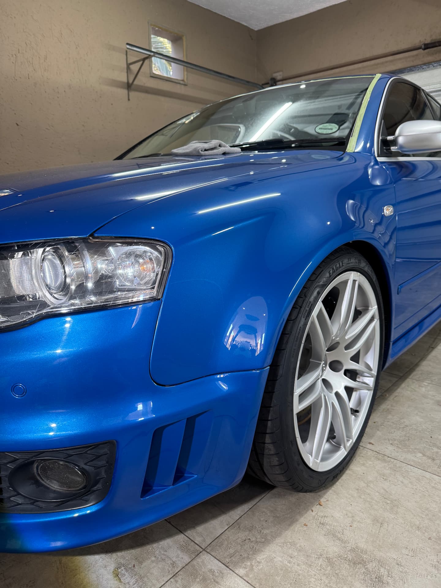 Blue Audi RS4 front quarter after multi-stage paint correction