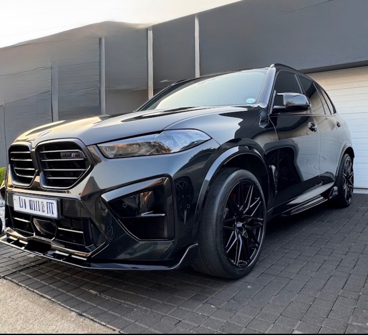 Black BMW X5 M with gloss ceramic coating finish after detailing in Johannesburg