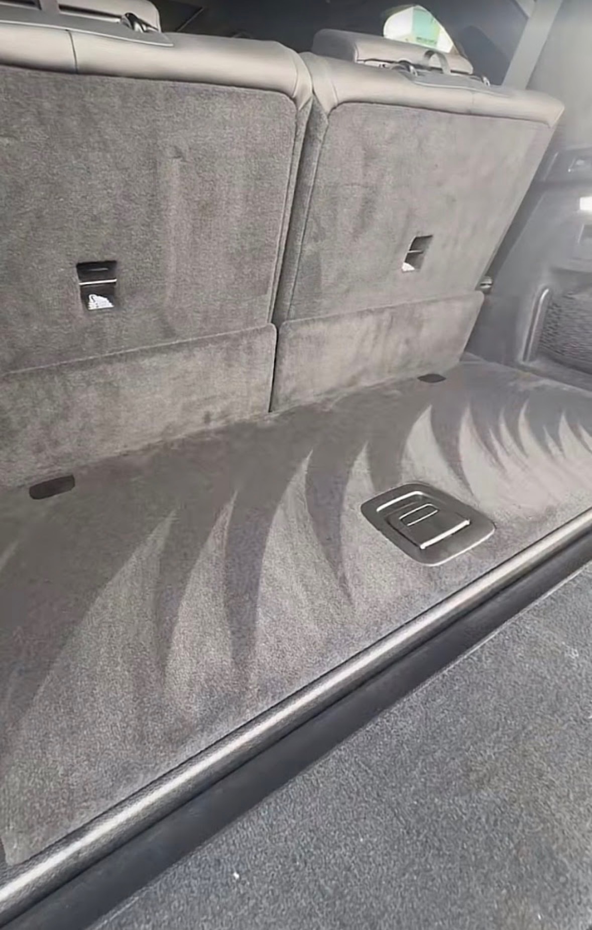 Freshly extracted and groomed boot carpet after interior detailing